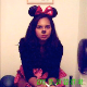 A hidden camera records a pretty, Hispanic girl in a Minnie Mouse costume pissing and shitting into a toilet. Plops are heard at 52 and 56 seconds into the clip. She smiles (to herself) at her own noises before wiping. About 3.5 minutes.